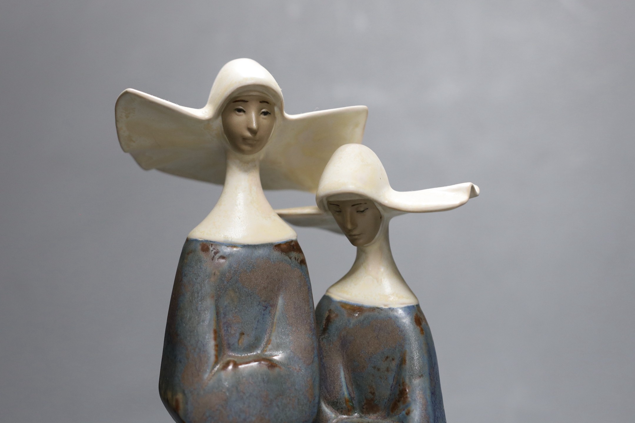 A Lladro stoneware group of two nuns, 34 cm high, boxed